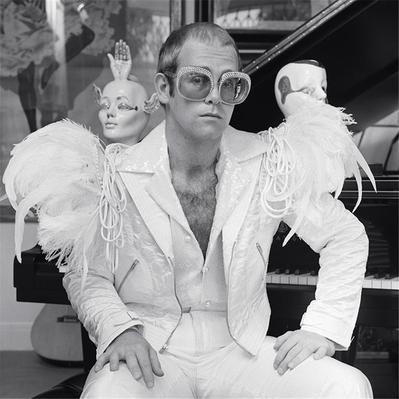 “People ask me all the time what my favourite Elton John picture is. And I can never really answer that because Elton graciously gave me so many opportunities to take a great picture. But this one really stands out. It’s his confidence that he developed over time when in front of the camera, my camera – and, of course, the outfit. This is signature Elton.” -Terry O’Neill
