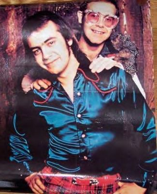 Elton John & Bernie Taupin, Los Angeles - An early portrait of Elton John with his long-time collaborator Bernie Taupin, taken when they made their first visit to Ed Caraeff’s Coldwater Canyon living room/photography studio.
