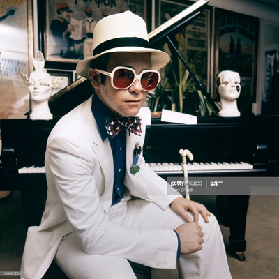 English pop singer Elton John at his home in Windsor, England, 1974. This photograph is from the album cover shoot for Elton John’s Greatest Hits album.
