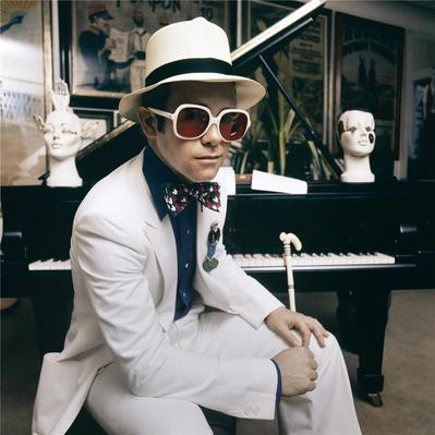 English pop singer Elton John at his home in Windsor, England, 1974. This photograph is from the album cover shoot for Elton John’s Greatest Hits album.
