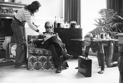 English singer and songwriter Elton John photographed in his office, circa 1970s.
