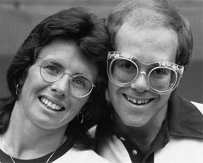 PHOTOGRAPHED BY TERRY O'NEILL
American top tennis player Bille Jean King with musician Elton John during Wimbledon, 1976 [sic]
