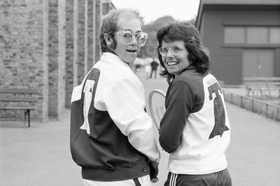 PHOTOGRAPHED BY TERRY O'NEILL
American top tennis player Bille Jean King with Elton John during Wimbledon, June 1974.
