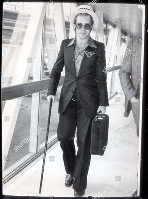 elton-john-singer-elton-john-pictured-at-london-airport-today-shutterstock-editorial-3317381a.jpg