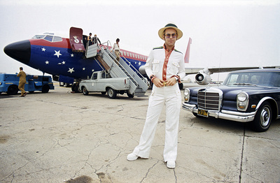 PHOTOGRAPHED BY TERRY O'NEILL
English singer Elton John on an airport runway in California during his 1974 US tour.
