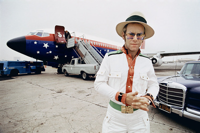 PHOTOGRAPHED BY TERRY O'NEILL
English singer Elton John on an airport runway in California during his 1974 US tour.
