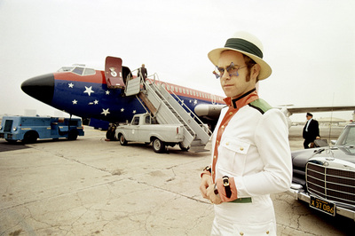 PHOTOGRAPHED BY TERRY O'NEILL
English singer Elton John on an airport runway in California during his 1974 US tour.
