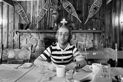 English pop singer Elton John at Caribou Ranch for the recording of his tenth album ‘Rock of The Westies’, Colorado, USA, 1974.
Caribou Ranch was a recording studio built in the Rocky Mountains by Grammy award-winning musician and producer James William Guercio in 1972.
