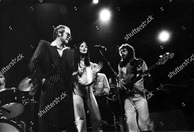 elton-john-cher-and-alan-gorrie-lead-singer-of-the-average-white-band-1975-shutterstock-editorial-53814a.jpg