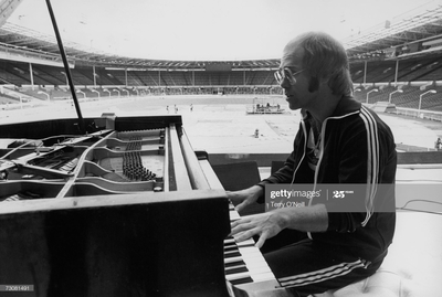 PHOTOGRAPHED BY TERRY O'NEILL
Elton John during rehearsal at Wembley, June 1975
