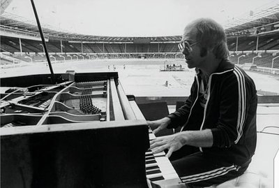 PHOTOGRAPHED BY TERRY O'NEILL
Elton John during rehearsal at Wembley, June 1975
