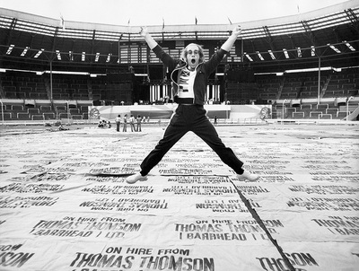 PHOTOGRAPHED BY TERRY O'NEILL
British singer Elton John leaps in the air during a rehearsal at Wembley Stadium, London, June 1975.
