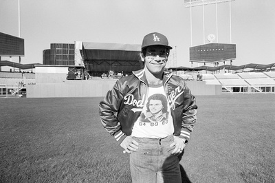 PHOTOGRAPHED BY TERRY O'NEILL
British pop singer and songwriter Elton John before his performance at Dodger Stadium, Los Angeles, 1975.
