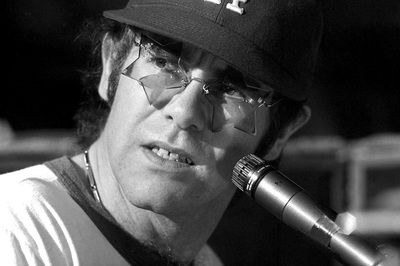 PHOTOGRAPHED BY TERRY O'NEILL
English singer songwriter Elton John rehearses at Dodger Stadium in Los Angeles, 1975.
