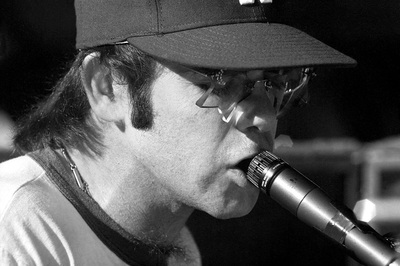 PHOTOGRAPHED BY TERRY O'NEILL
English singer songwriter Elton John rehearses at Dodger Stadium in Los Angeles, 1975.
