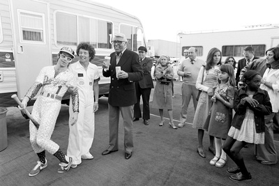 PHOTOGRAPHED BY TERRY O'NEILL
British singer Elton John and American tennis player Billie Jean King greet fans backstage at Elton John’s Dodger Stadium concert, 1975.
