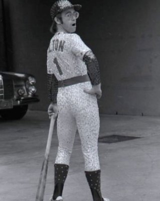 PHOTOGRAPHED BY TERRY O'NEILL
English singer and songwriter Elton John poses in Bob Mackie’s now famous sequined white Dodgers uniform at Dodger Stadium in Los Angeles, October 1975.
