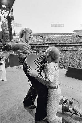 PHOTOGRAPHED BY TERRY O'NEILL
“Davey Johnstone has been Elton’s guitarist since the early 1970s – and is still performing with him to this very day! Here they are at Dodger Stadium, a true rock-and-roll moment.” -Terry O’Neill
