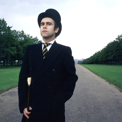 “This is an outtake from the album cover shoot for A Single Man, released in 1978. We did this shoot on the Long Walk in Windsor Great Park in Berkshire. We decided to go back to the classic style. The back of the album was single, the same shot but from behind.”
- Terry O’Neill
