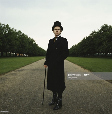 “This is an outtake from the album cover shoot for A Single Man, released in 1978. We did this shoot on the Long Walk in Windsor Great Park in Berkshire. We decided to go back to the classic style. The back of the album was single, the same shot but from behind.”
- Terry O’Neill
