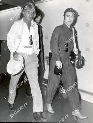 sir-elton-john-singer-and-musician-1978-elton-john-and-rod-stewat-arrive-at-london-airport-from-rio-shutterstock-editorial-892633a.jpg