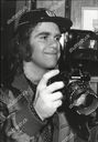 elton-john-holding-an-olympus-camera-during-his-trip-to-leningrad-shutterstock-editorial-3773244a.jpg