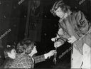 sir-elton-john-is-presented-with-flowers-by-fans-at-a-concert-in-leningrad-russia-shutterstock-editorial-3766798a.jpg