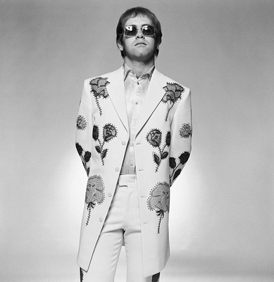 English pop star and pianist Elton John wearing a floral applique suit and sunglasses during a photoshoot in promotion of his album ‘Honkey Chateau’, 1972.
