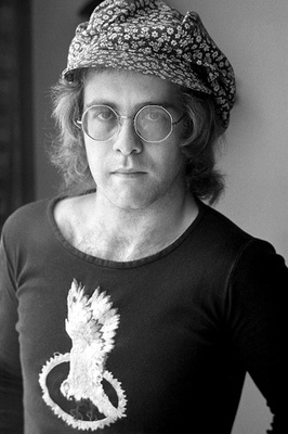 “This is from that very first photo shoot I had with Elton in 1972. I had a hard time selling these early portraits. British Vogue finally took them and they ran one picture, rather small. A few months later, all the magazines and newspapers were calling me, looking for Elton. When I left Elton’s flat, he gave me a cassette labelled ’17-11-70’ and it was sensational. He was going to be a very big star – there was no doubt in my mind – and I was glad to be there at the beginning.” -Terry O’Neill
